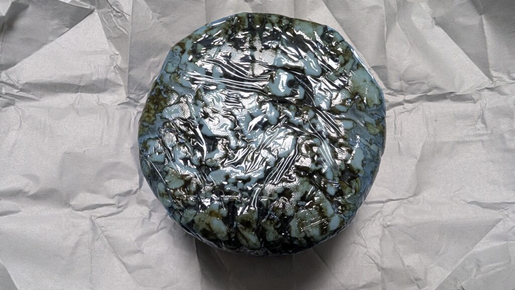Kuromatsunai blue cheese in plastic wrap